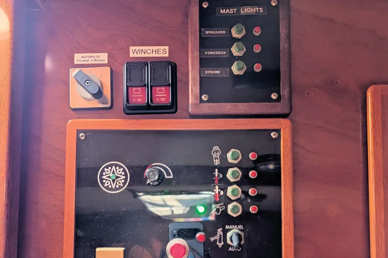 Iteration Yacht Photos Pics Control panel of a 1994 Amel 53 Super Maramu sailboat with switches and indicators.