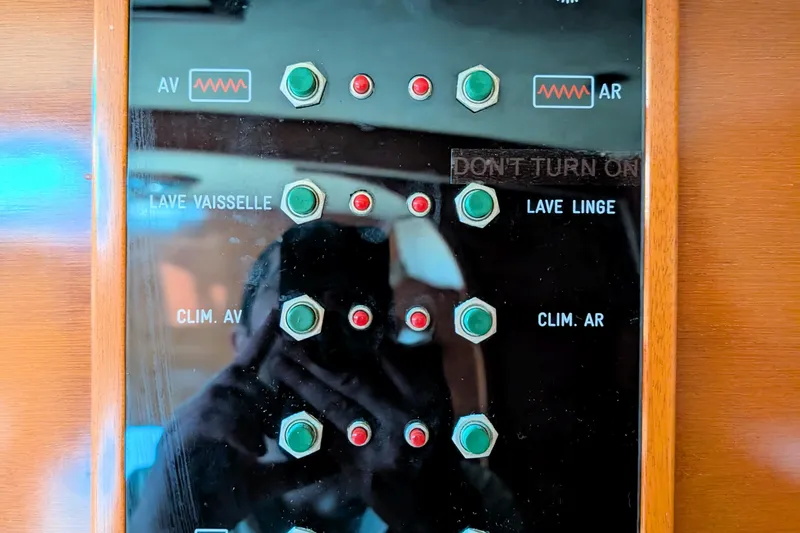 Iteration Yacht Photos Pics Control panel on a 1994 Amel 53 Super Maramu yacht with labeled switches.