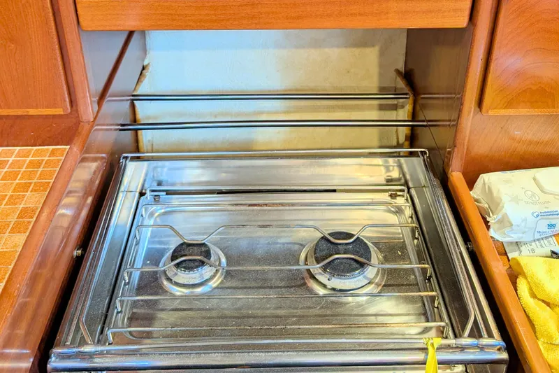 Iteration Yacht Photos Pics Stainless steel stove in 1994 Amel 53 Super Maramu yacht kitchen.