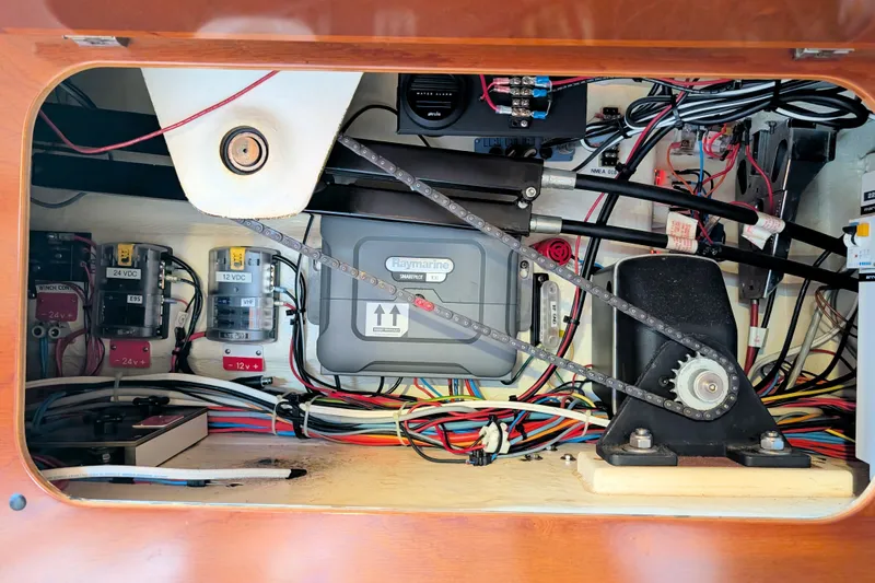 Iteration Yacht Photos Pics Electrical panel of a 1994 Amel 53 Super Maramu sailboat, showcasing wiring and components.