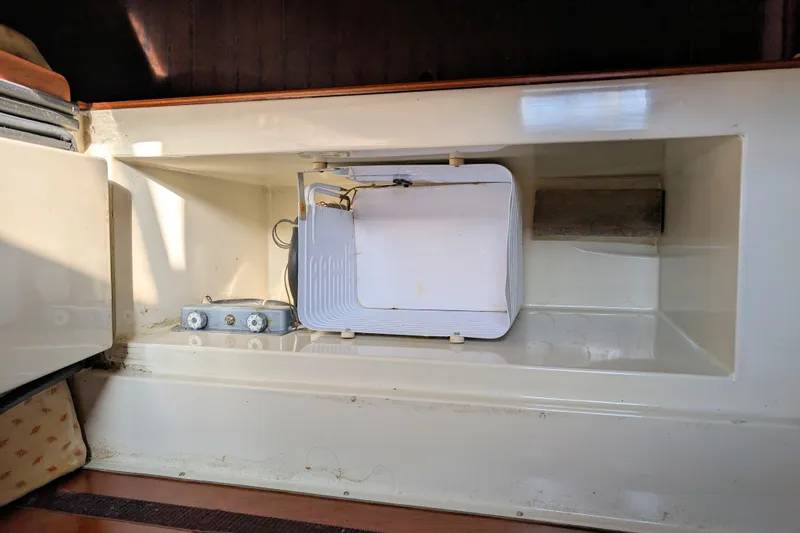 Iteration Yacht Photos Pics Interior compartment of a 1994 Amel 53 Super Maramu sailboat, showing storage space.