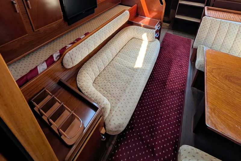 Iteration Yacht Photos Pics Interior of 1994 Amel 53 Super Maramu yacht with elegant seating and wooden finishes.