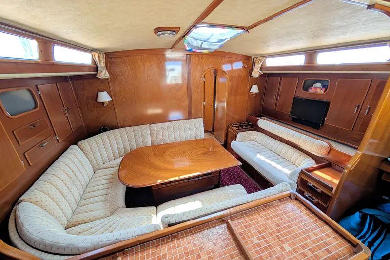 Iteration Yacht Photos Pics Luxurious interior of 1994 Amel 53 Super Maramu yacht with elegant wood finish.