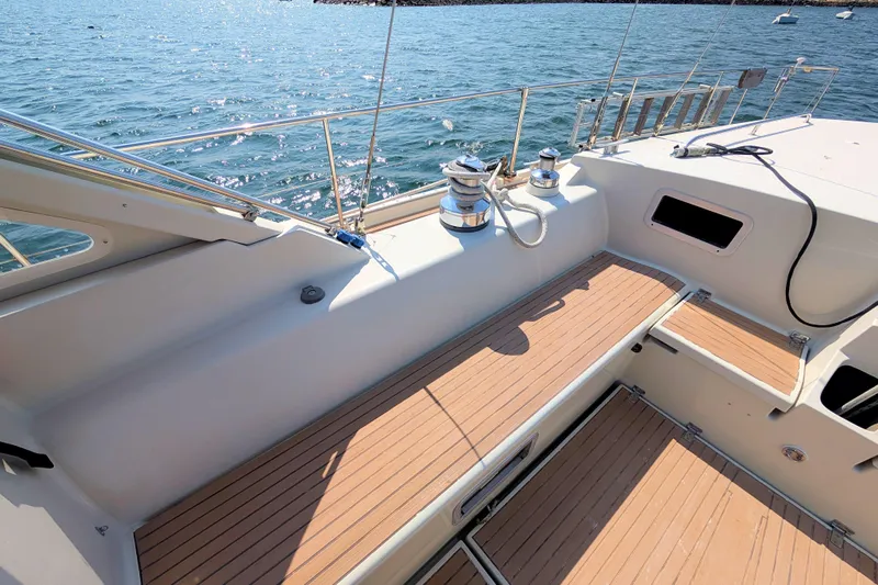 Iteration Yacht Photos Pics Deck of 1994 Amel 53 Super Maramu sailboat with wooden flooring and winches.