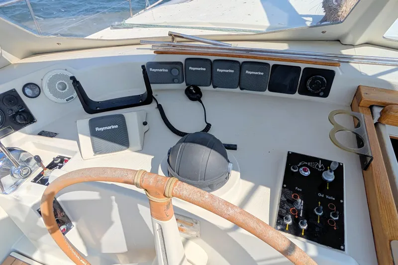 Iteration Yacht Photos Pics Cockpit of 1994 Amel 53 Super Maramu sailboat with Raymarine navigation equipment.
