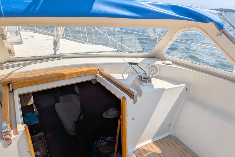 Iteration Yacht Photos Pics Cockpit view of 1994 Amel 53 Super Maramu sailboat with open cabin hatch.