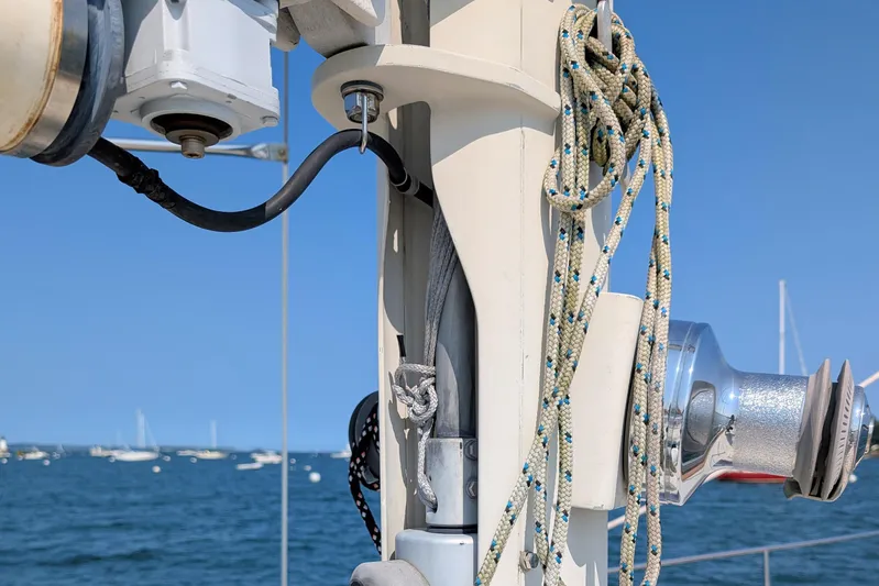 Iteration Yacht Photos Pics Close-up of 1994 Amel 53 Super Maramu sailboat mast with ropes and winch.