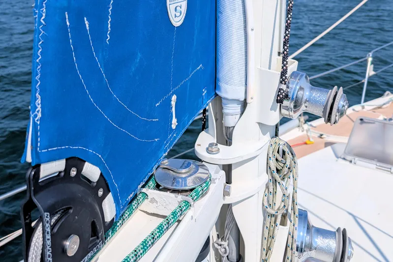 Iteration Yacht Photos Pics Close-up of 1994 Amel 53 Super Maramu sailboat rigging and blue sail.