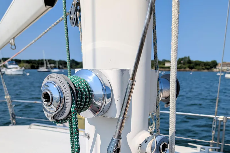Iteration Yacht Photos Pics Close-up of winch and rigging on 1994 Amel 53 Super Maramu sailboat, with ocean background.