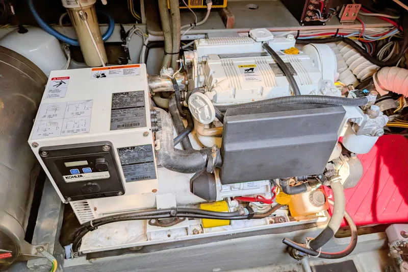Iteration Yacht Photos Pics Engine compartment of a 1994 Amel 53 Super Maramu sailboat, featuring a Kohler generator.