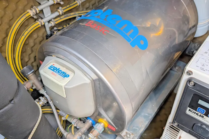 Iteration Yacht Photos Pics Engine room of 1994 Amel 53 Super Maramu with Isotemp Basic water heater.