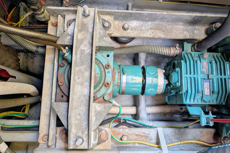 Iteration Yacht Photos Pics Engine compartment of a 1994 Amel 53 Super Maramu sailboat, showcasing mechanical components.