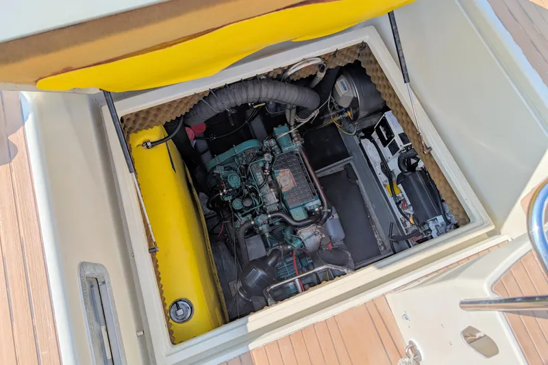 Iteration Yacht Photos Pics Engine compartment of a 1994 Amel 53 Super Maramu sailboat, showcasing mechanical components.