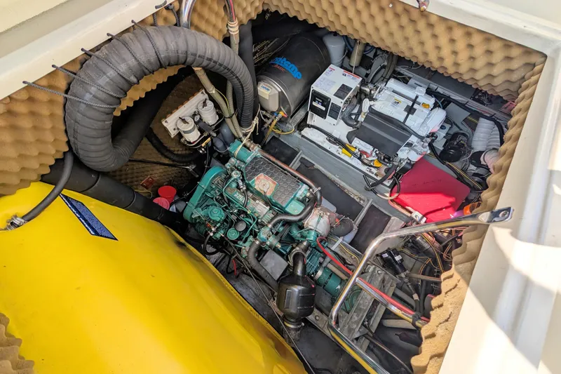 Iteration Yacht Photos Pics Engine room of a 1994 Amel 53 Super Maramu sailboat, showcasing mechanical components.