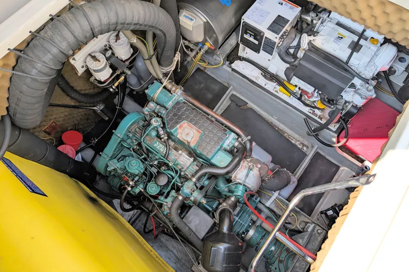 Iteration Yacht Photos Pics Engine room of a 1994 Amel 53 Super Maramu sailboat, showcasing mechanical components.