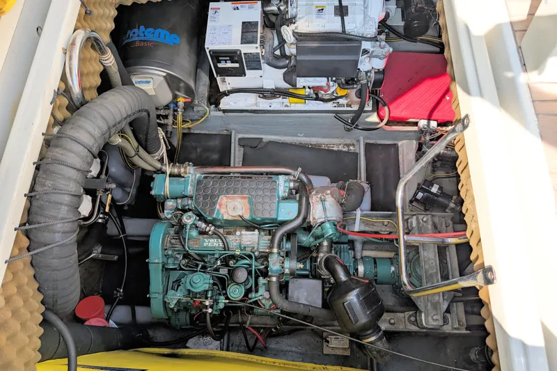 Iteration Yacht Photos Pics Engine compartment of a 1994 Amel 53 Super Maramu sailboat, featuring a Volvo Penta engine.