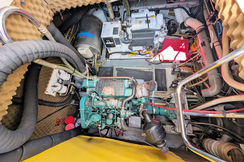 Iteration Yacht Photos Pics Engine room of a 1994 Amel 53 Super Maramu sailboat, showcasing mechanical components.