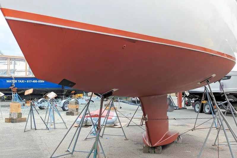 Iteration Yacht Photos Pics 1998 Amel 53 Super Maramu sailboat on stands, showcasing hull and keel design.