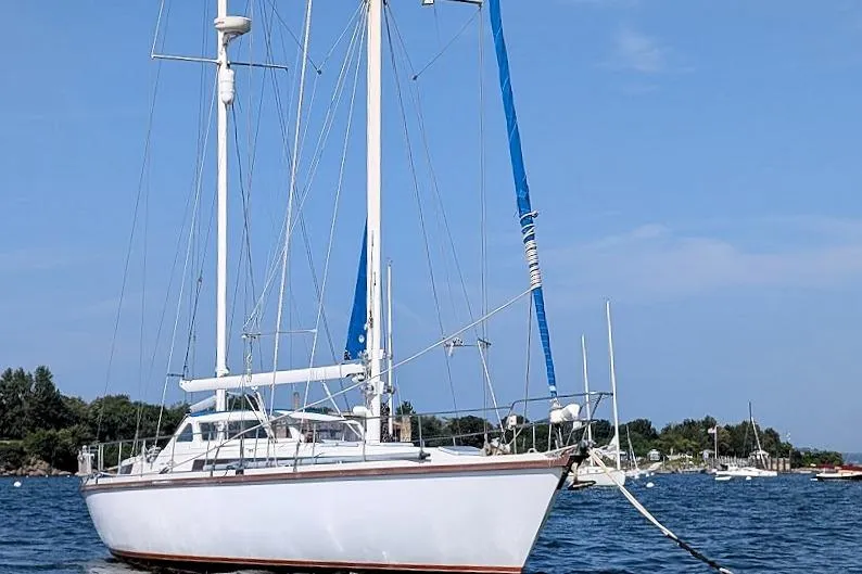 Iteration Yacht Photos Pics Sailing yacht Amel 53 Super Maramu 1998 anchored on calm waters.