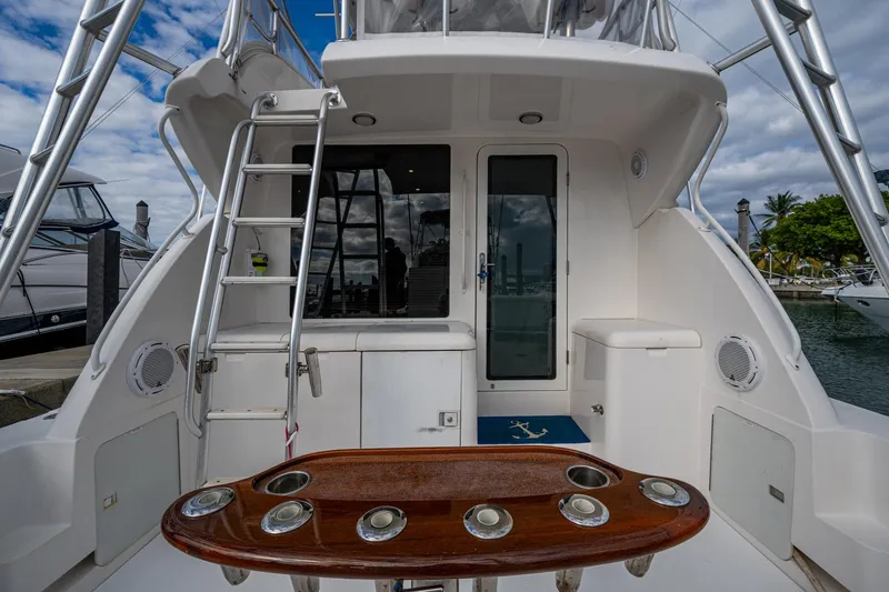 Vet Billz Yacht Photos Pics Bertram 390 yacht cockpit with ladder and seating, 2001 model, docked at marina.
