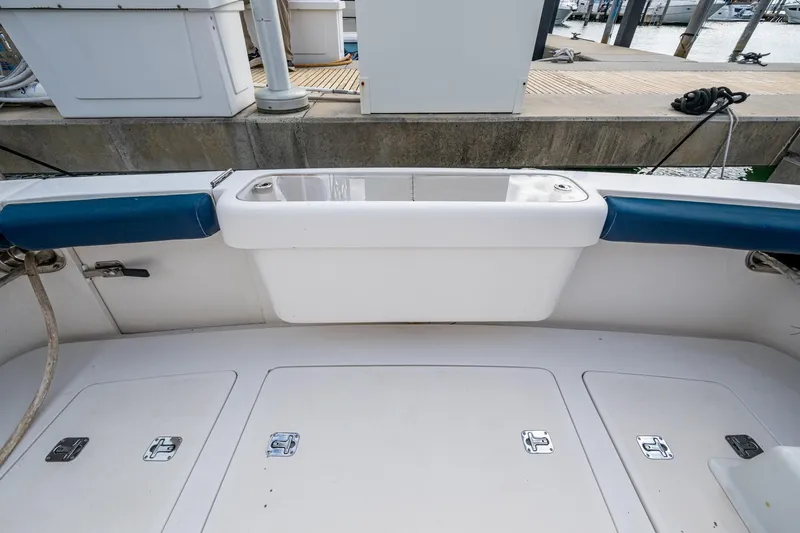 Vet Billz Yacht Photos Pics Bertram 390 boat deck, 2001 model, featuring storage compartments and seating.