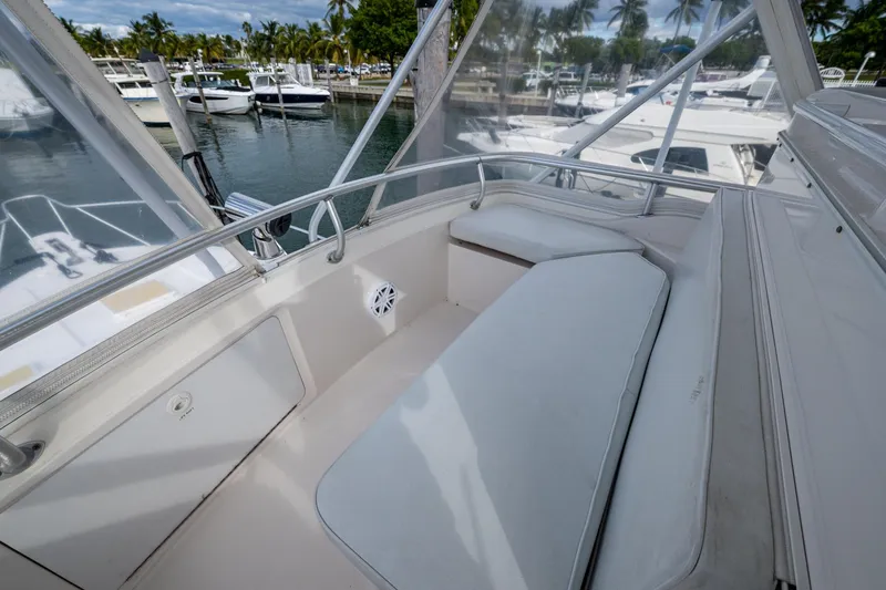 Vet Billz Yacht Photos Pics 2001 Bertram 390 boat interior with white seating, docked at marina.
