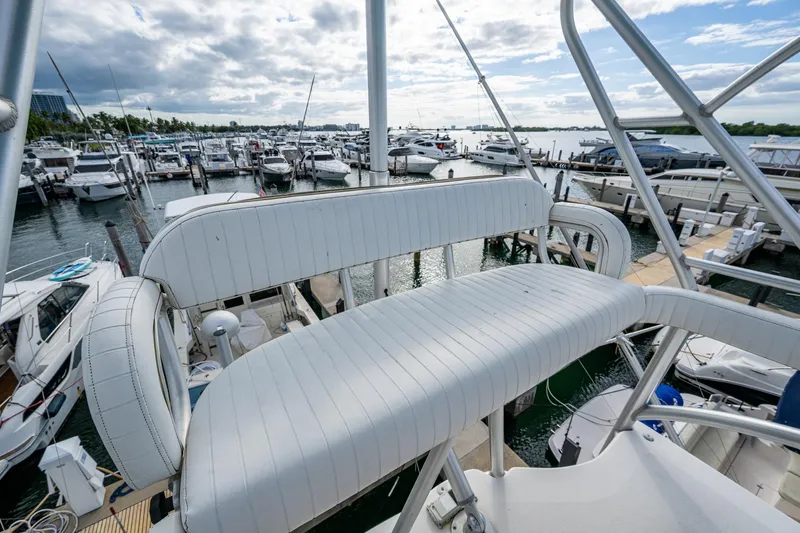 Vet Billz Yacht Photos Pics Bertram 390 yacht, 2001 model, docked at marina with scenic waterfront view.