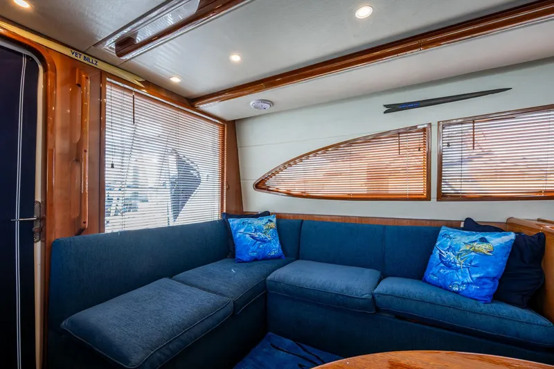 Vet Billz Yacht Photos Pics Luxurious interior of 2001 Bertram 390 yacht with blue seating and nautical decor.