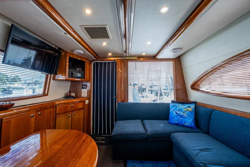 Vet Billz Yacht Photos Pics Luxurious interior of a 2001 Bertram 390 yacht with plush seating and modern amenities.