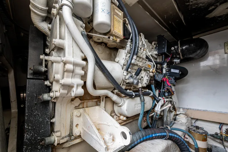 Vet Billz Yacht Photos Pics Engine compartment of a 2001 Bertram 390 boat, showcasing detailed mechanical components.