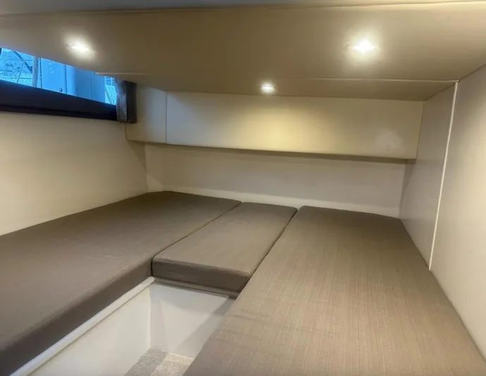  Yacht Photos Pics Interior cabin of a 2016 Carver C43 Coupe with cushioned seating and ambient lighting.