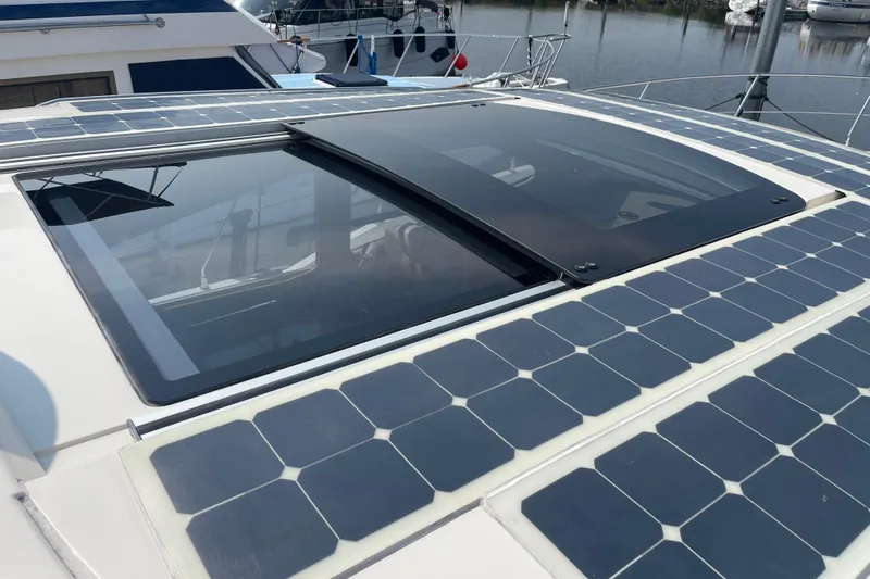  Yacht Photos Pics Rooftop solar panels on a 2016 Carver C43 Coupe yacht by the water.