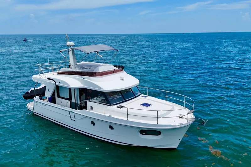  Yacht Photos Pics 2021 Beneteau Swift Trawler 41 Fly cruising on open blue sea.