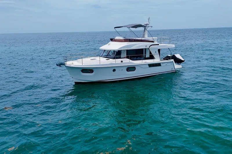  Yacht Photos Pics 2021 Beneteau Swift Trawler 41 Fly cruising on open sea.