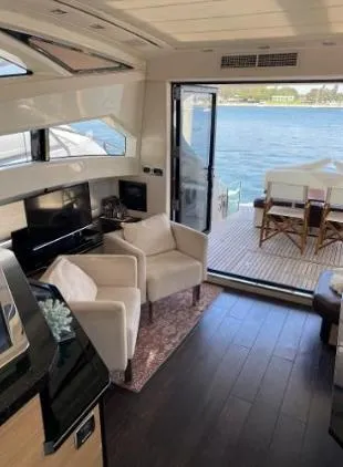 Why Knot Yacht Photos Pics Luxurious 2011 Marquis Sport Coupe yacht interior with elegant seating and ocean view.