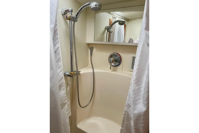  Yacht Photos Pics Shower area in 2003 Silverton 38 Convertible boat with handheld showerhead and curtain.