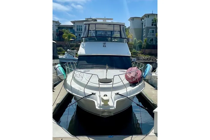  Yacht Photos Pics 2003 Silverton 38 Convertible yacht docked at marina, front view.