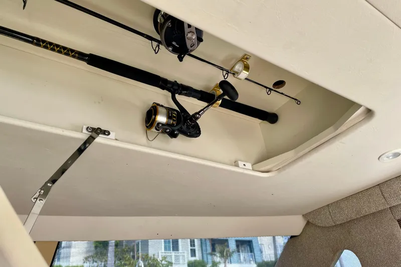  Yacht Photos Pics Fishing rods stored in the ceiling compartment of a 2003 Silverton 38 Convertible boat.