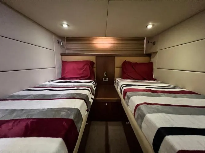 El Andariego Yacht Photos Pics Twin cabin with striped bedding in 2008 Sunseeker Portofino 47 yacht.