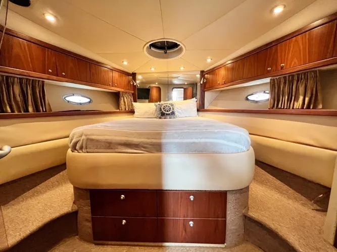 El Andariego Yacht Photos Pics Luxurious interior of 2008 Sunseeker Portofino 47 yacht with elegant wood finishes.