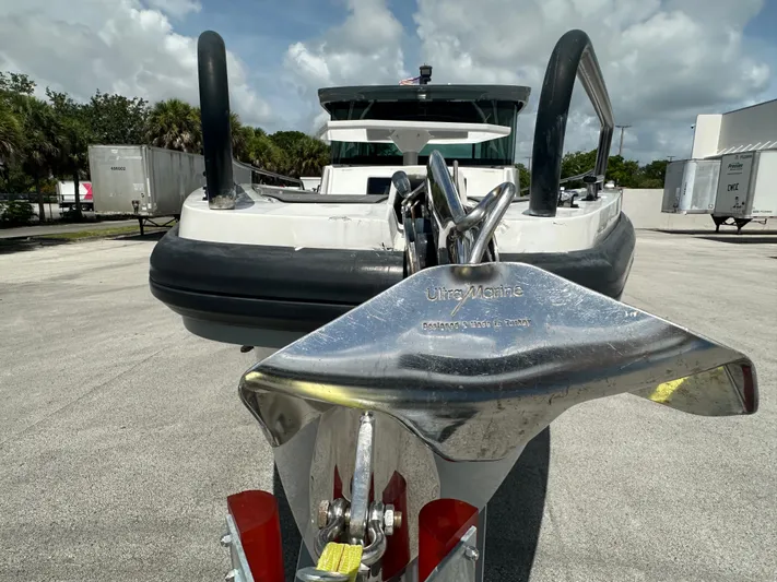  Yacht Photos Pics Axopar 37 XC CROSS CABIN 2020 with Ultra Marine anchor, parked outdoors.