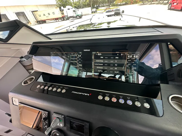  Yacht Photos Pics Dashboard of 2020 Axopar 37 XC CROSS CABIN with Simrad display and control panel.