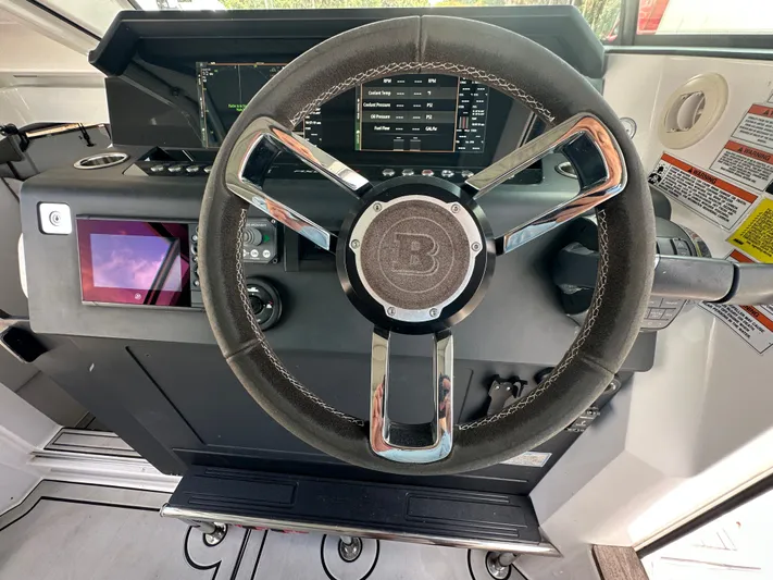  Yacht Photos Pics Steering wheel and dashboard of 2020 Axopar 37 XC CROSS CABIN boat.