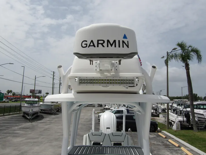  Yacht Photos Pics 2021 Tidewater 2700 Carolina Bay boat with Garmin radar, parked in a marina.