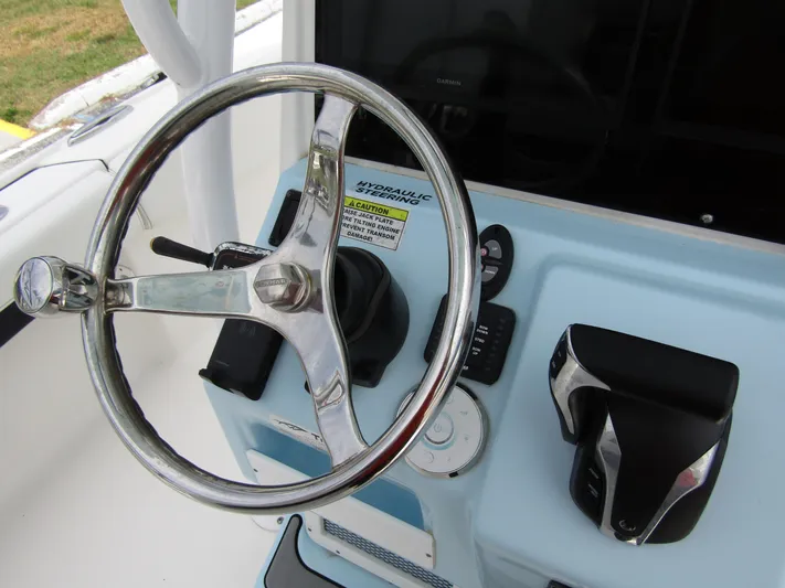  Yacht Photos Pics Steering wheel and controls of 2021 Tidewater 2700 Carolina Bay boat.