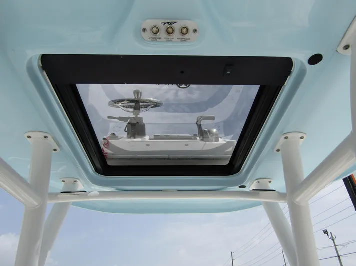  Yacht Photos Pics 2021 Tidewater 2700 Carolina Bay boat roof view with steering wheel visible through skylight.