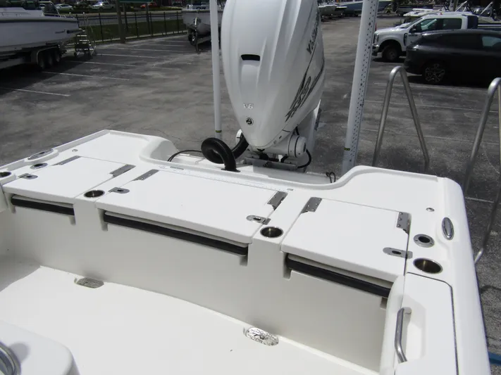  Yacht Photos Pics 2021 Tidewater 2700 Carolina Bay boat with outboard motor in parking lot.