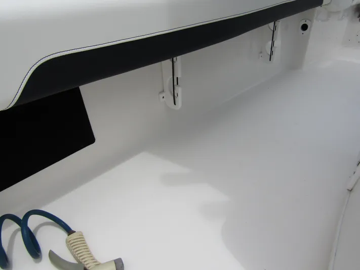  Yacht Photos Pics 2021 Tidewater 2700 Carolina Bay boat interior detail with storage compartment.