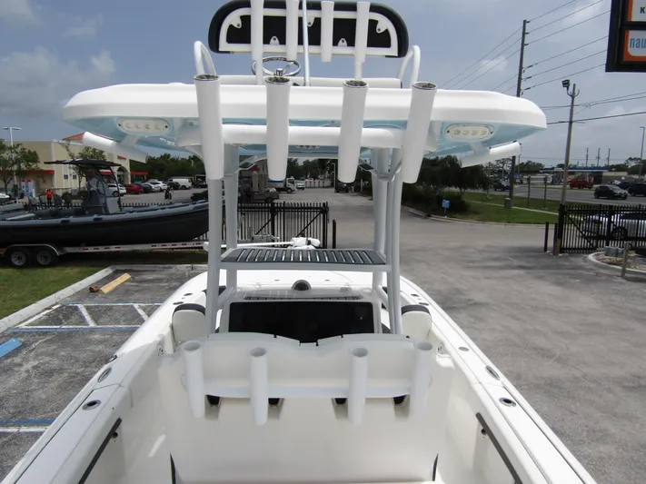  Yacht Photos Pics 2021 Tidewater 2700 Carolina Bay boat with T-top and rod holders in a parking lot.
