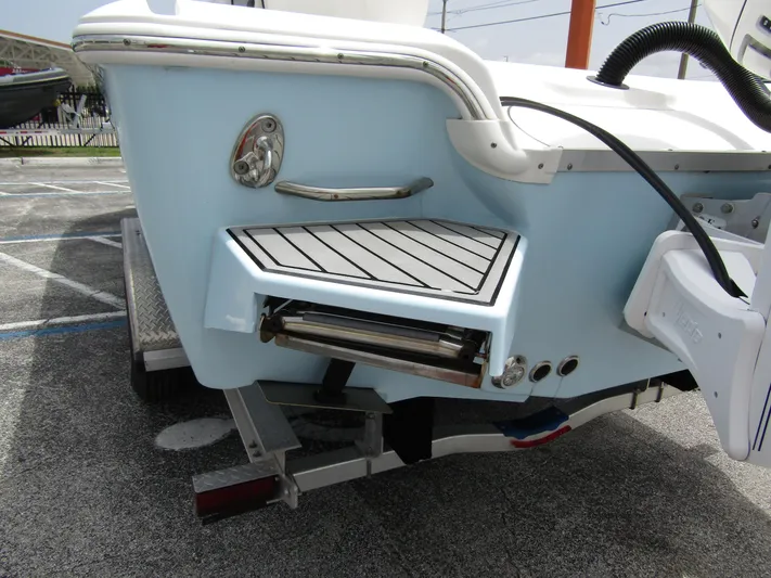  Yacht Photos Pics 2021 Tidewater 2700 Carolina Bay boat stern with swim platform and ladder.